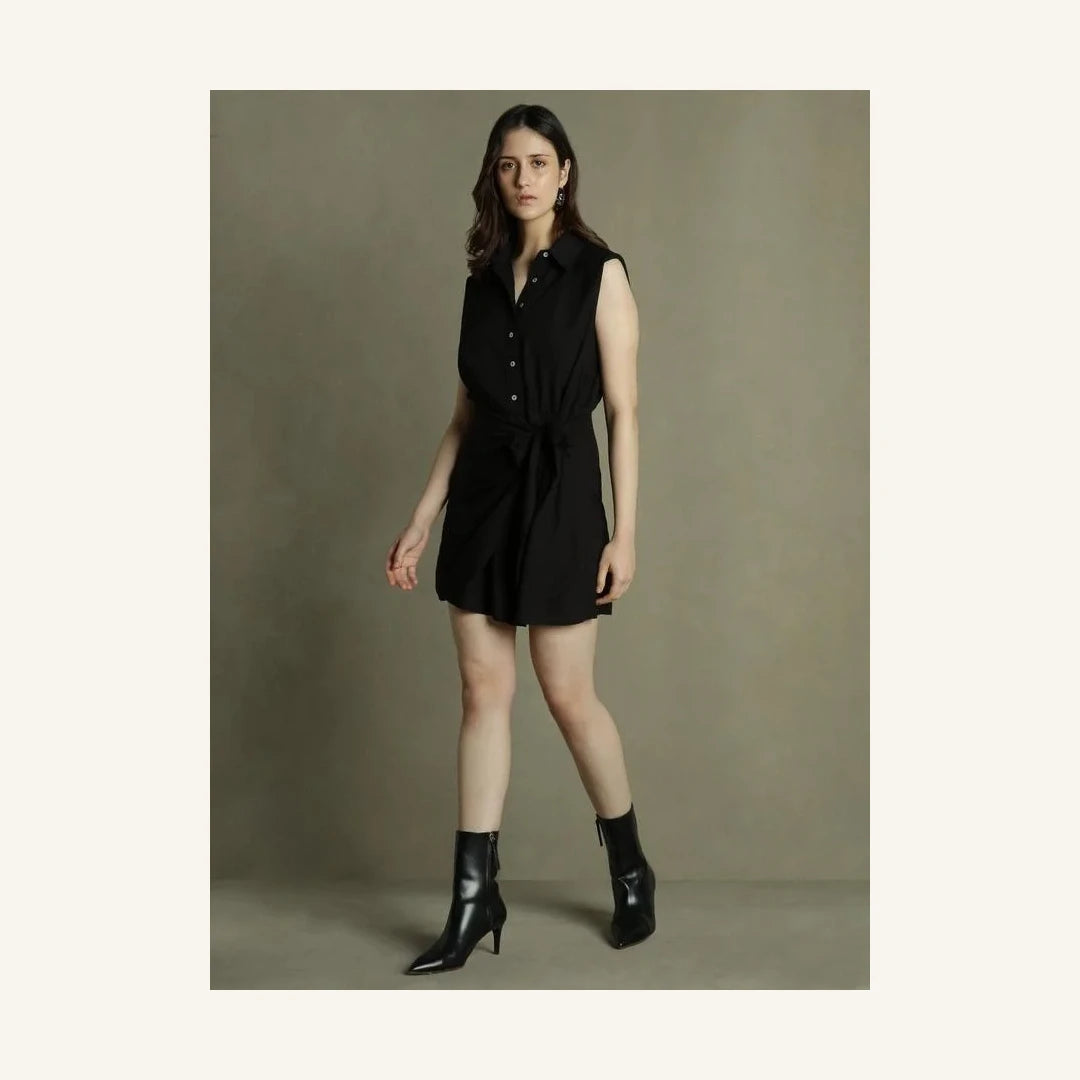 black sleeveless mini shirt dress with collared neck and tie waist