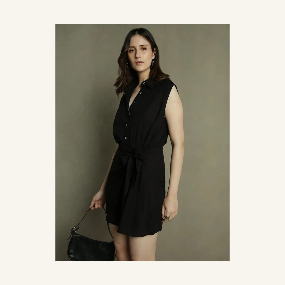 black sleeveless mini shirt dress with collared neck and tie waist