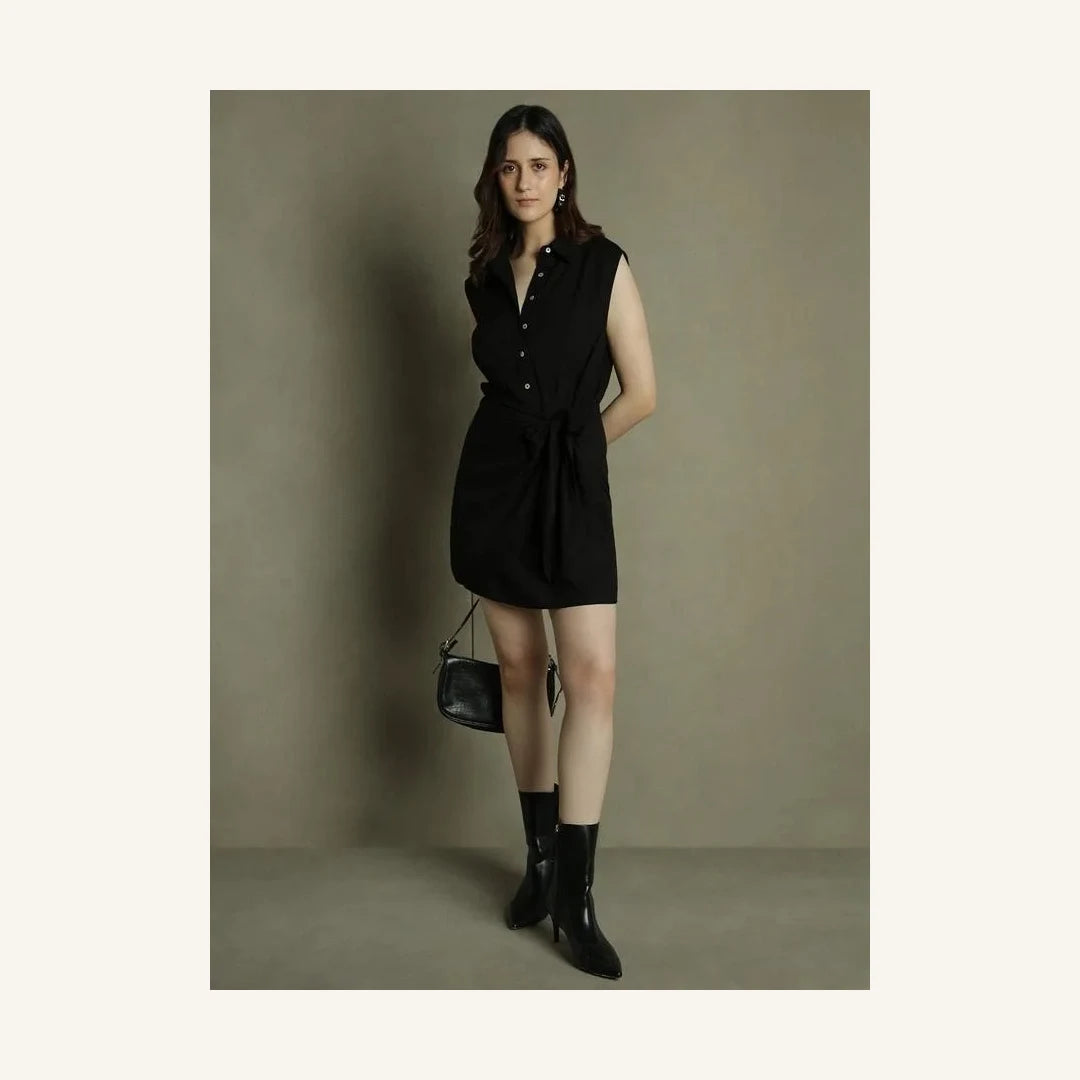 black sleeveless mini shirt dress with collared neck and tie waist