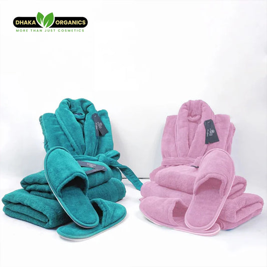Luxury couple bathroom set with pink and teal velour bathrobes, towels, and slippers