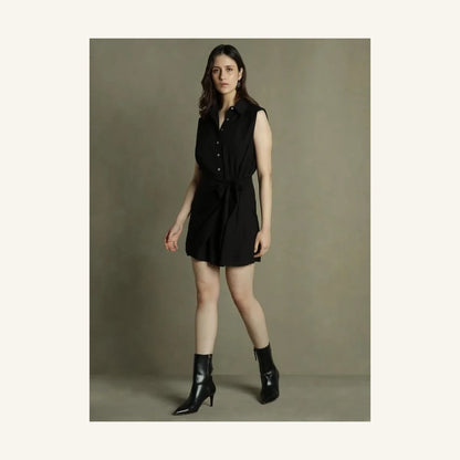black sleeveless mini shirt dress with collared neck and tie waist