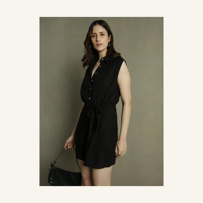 black sleeveless mini shirt dress with collared neck and tie waist