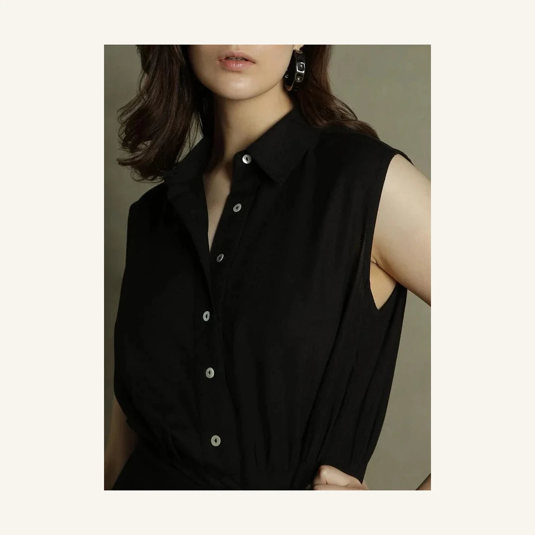 black sleeveless mini shirt dress with collared neck and tie waist
