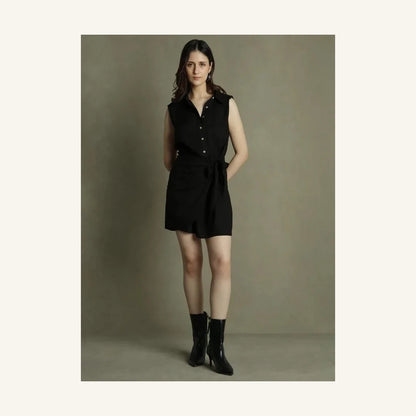 black sleeveless mini shirt dress with collared neck and tie waist